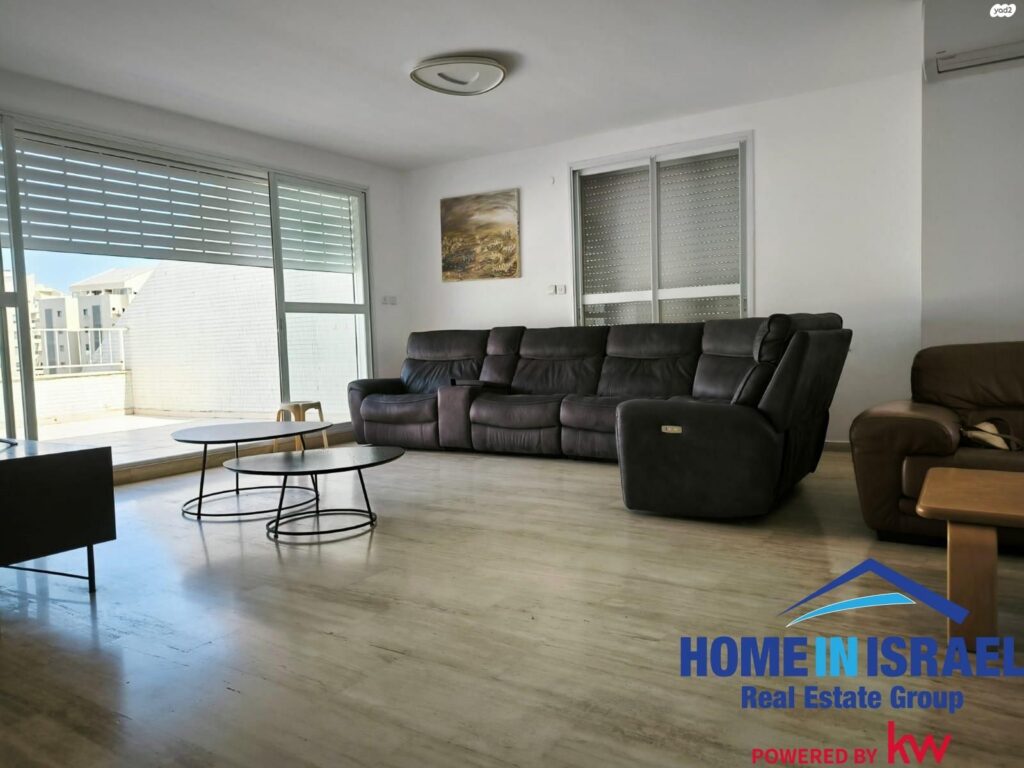 Spacious living room in duplex penthouse Ya'akov Dori Netanya with balcony access