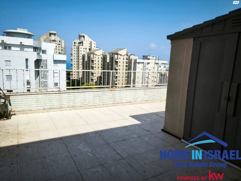 Large open rooftop terrace in Netanya penthouse with city views and storage