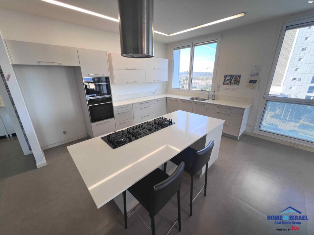 Luxury open plan living room and kitchen with sea view in Netanya apartment