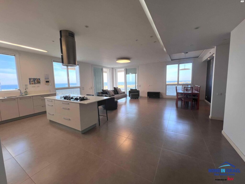 Luxury open plan living room and kitchen with sea view in Netanya apartment
