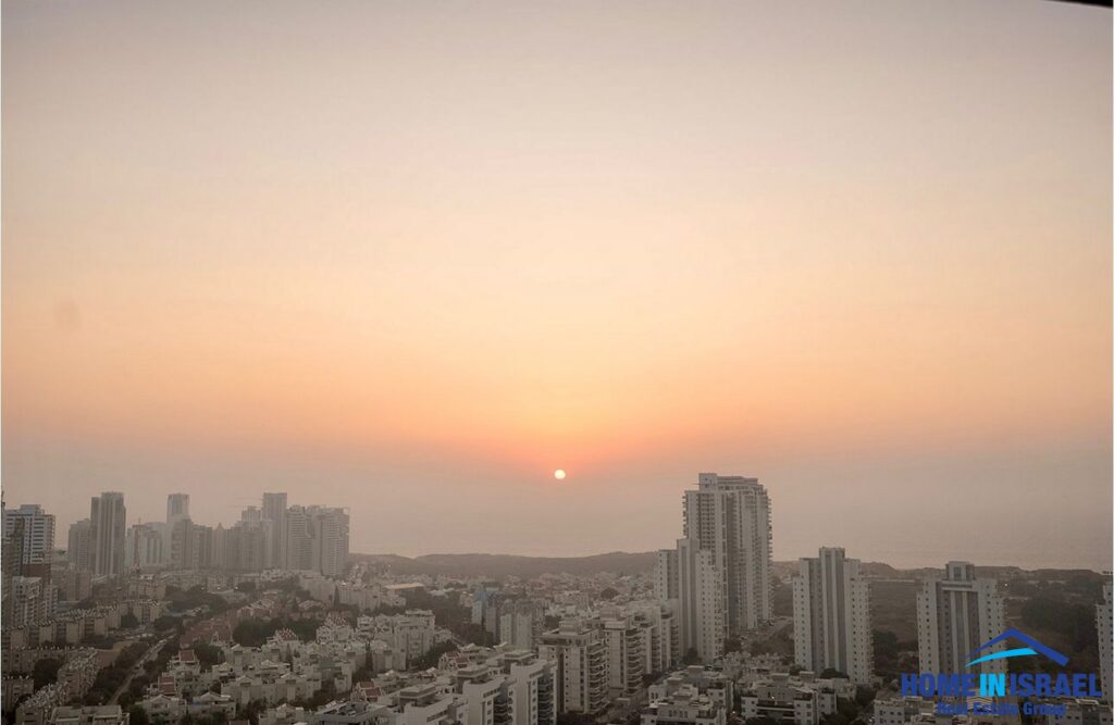 Panoramic Mediterranean sea view from the 31st-floor balcony of a luxury 3-room apartment for sale in the Shaviro project on Karl Popper Street, Netanya.